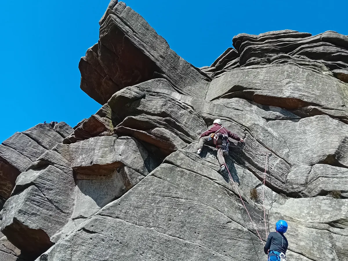 Mr Hussain's patient rock climbing on a gritstone crag after hip resurfacing