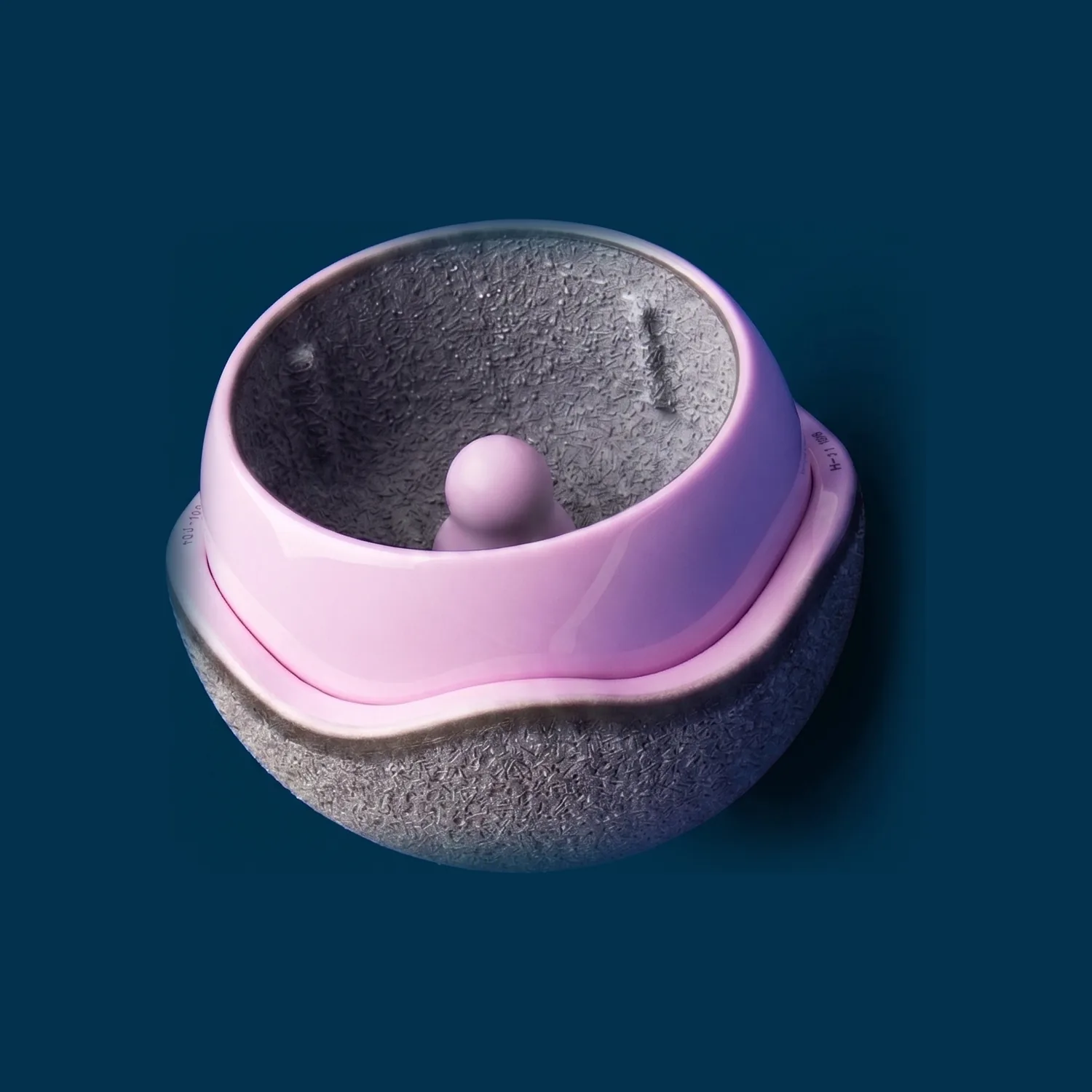 H1 ceramic-on-ceramic hip resurfacing implant by Embody, photographed on a navy background