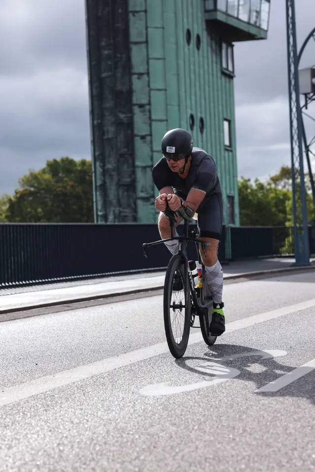 Martin in the aero position on his time-trial bike crossing a Copenhagen bridge during Ironman Copenhagen after hip resurfacing