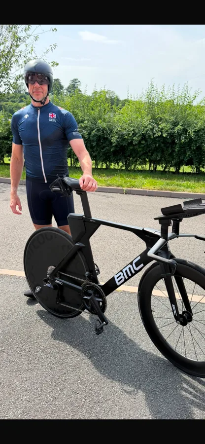 Martin standing with his time-trial bike in training for Ironman Copenhagen after hip resurfacing