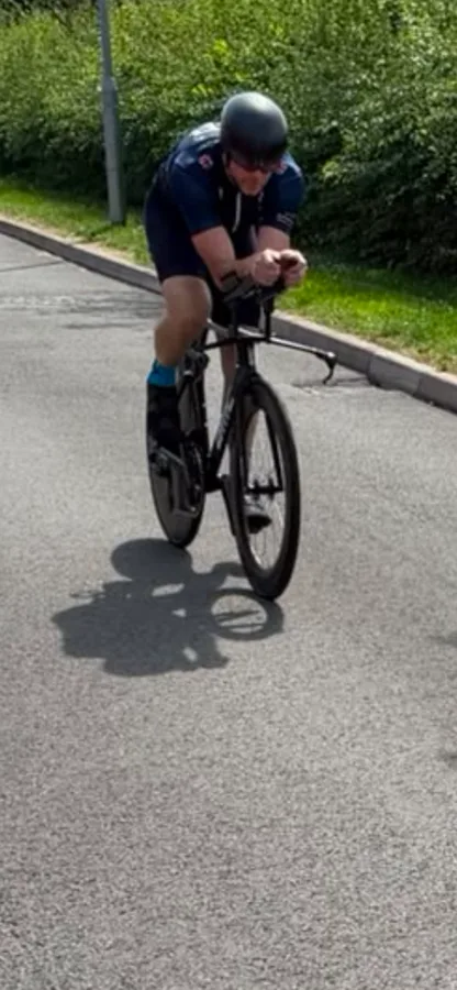 Martin riding his time-trial bike in aero position during triathlon training after hip resurfacing