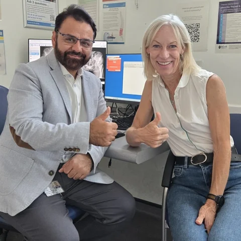 Kathy with Mr Shakir Hussain in clinic after her ceramic hip resurfacing at the Royal Orthopaedic Hospital, Birmingham