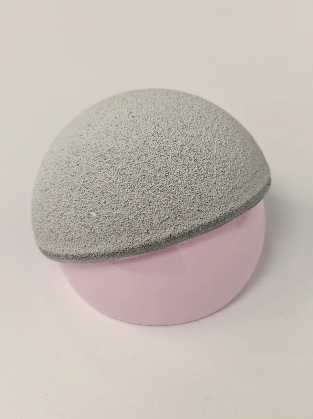 ReCerf ceramic-on-ceramic hip resurfacing implant sample: the textured, bone-facing outer surface of the acetabular cup resting on the polished BIOLOX delta ceramic femoral cap, as used by Mr Shakir Hussain, Birmingham